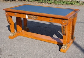 An Empire style gilt metal mounted bird's eye maple bureau plat fitted three drawers, width 160cm, depth 89cm, height 77cm